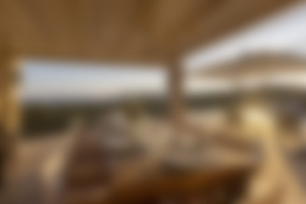 The shady, sea-view al fresco dining area down on the pool terrace.